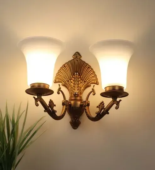 Decorative wall sconces flanking a mirror.