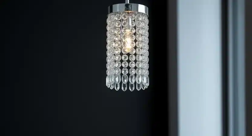 Single crystal pendant light above a kitchen island, creating a modern look.