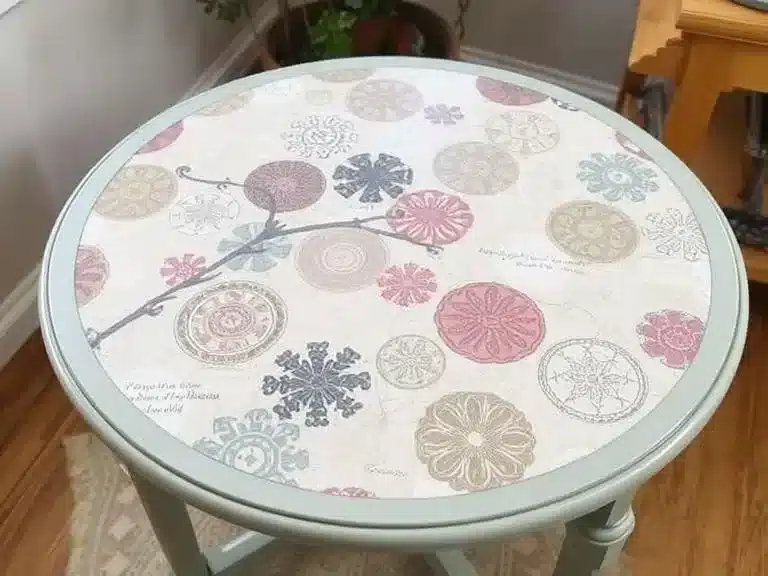 A decoupaged table with patterned paper applied for a stylish update.