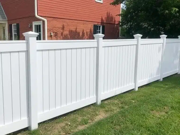 Repaired and freshened-up fence with a clean, modern look for the front yard.