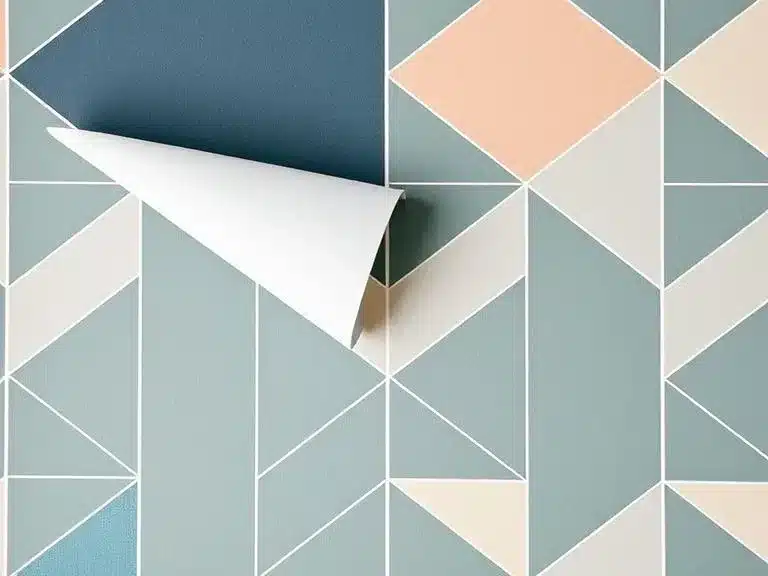 Peel-and-stick wallpaper applied to a wall, adding a modern touch to the room.